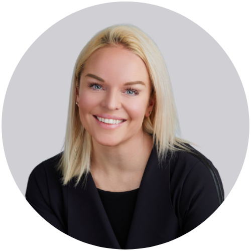 A woman with blonde hair smiling for a professional headshot